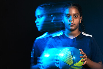 Young female soccer player in motion colorful portrait