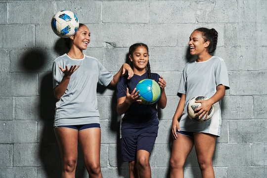 Teenage female soccer players indoors