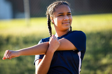 Girl soccer team stretches and warm up for scrimmage game