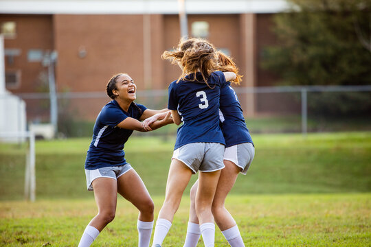 Teen girls celebrating after successful game victory