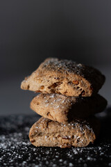 Three sweet bread cakes on a black background, typical sweet in some areas of Spain that is made in autumn