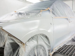 epoxy primer is applied to the car body. car painting process