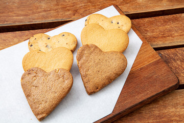 Chocolate cookies on wooden table. Chocolate chip cookies shot