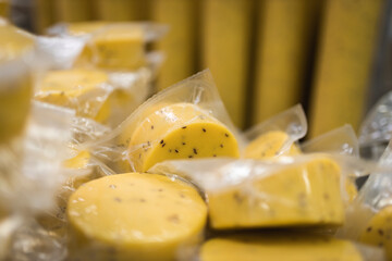 cheese with cumin seeds in package yellow 