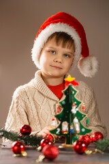 Portrait of a boy in a Santa hat