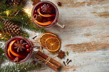 Mulled wine with spices and Christmas lights
