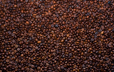 Brown background of a large number of whole coffee beans
