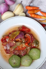 Sambal Belimbing Wuluh Or Spicy Averrhoa bilimbi Sauce ingredients, Averrhoa bilimbi, Starfruit, Red Chilies, Onion, garlic, and salt. 