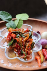 Sambal Jeruk Nipis Or Spicy Lime Sauce with ingredients, Lime, Red Chilies, Green Chilies, garlic, and salt. 
