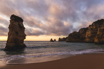 Praia de Dona Ana Lagos Portugal beach water waves Atlantic ocean sand rock formations hills...