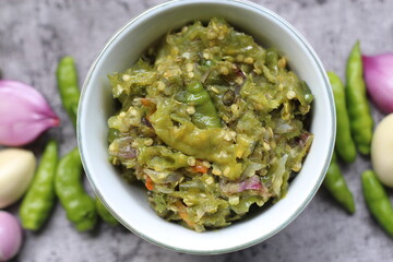 Sambal ijo Or Green chili sauce with ingredients, Greem chilies, onion, garlic, and salt 