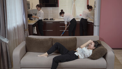 Housewife housework concept. A very tired woman is resting on the couch after hard chores in the kitchen.