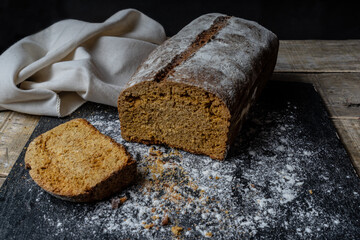 Freshly baked grain oats brown bread close up photos. Gastronomic photography.
Dark food  photography