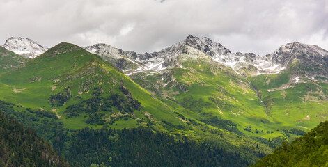 Fototapeta na wymiar Beautiful mountain landscape with green meadow at Caucasus mountains.