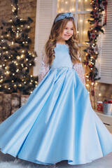 Naklejka premium Little cute happy adorable girl in elegant fashion dress in christmas decorations. Christmas holidays, celebaration concept