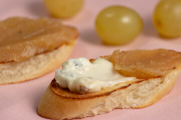 homemade quince jam. slices of bread with cheese and quince jam.