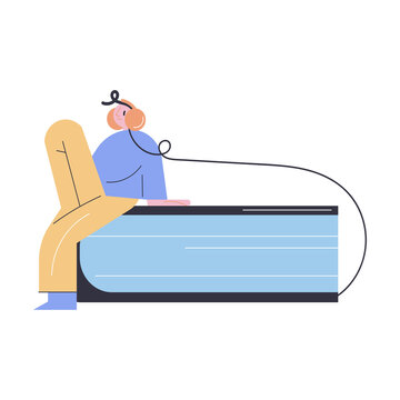 Young positive man in headphones sitting and listening electronic book in e-libruary