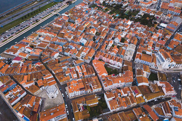 Obraz premium drone shot aerial view from above look Aveiro Portugal cloudy day city center rooftops orange red 