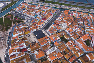 Obraz premium drone shot aerial view from above look Aveiro Portugal cloudy day city center rooftops orange red 
