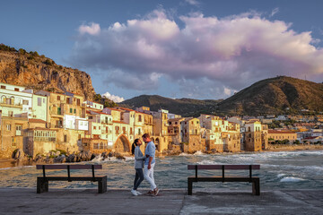 Cefalu, the medieval village of Sicily island, Province of Palermo, Italy. Europe, a couple on vacation at the Italian Island Sicilia