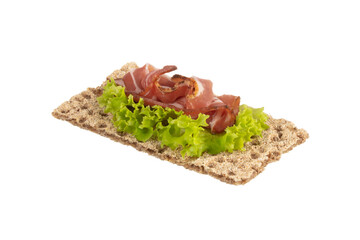 Variety of mini sandwiches with cream cheese, vegetables and salami.