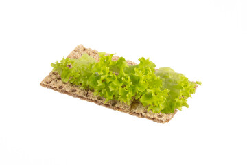 Variety of mini sandwiches with cream cheese, vegetables and salami.