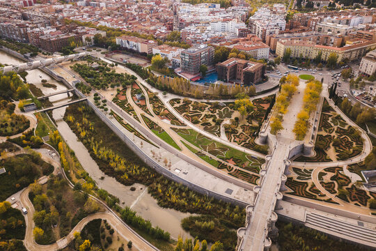 Toledo Bridge Puente de Toledo drone shot aerial look from above Spain Madrid capital Manzanares river garden shaped bushes autumn Footbridge
Puente de Arganzuela