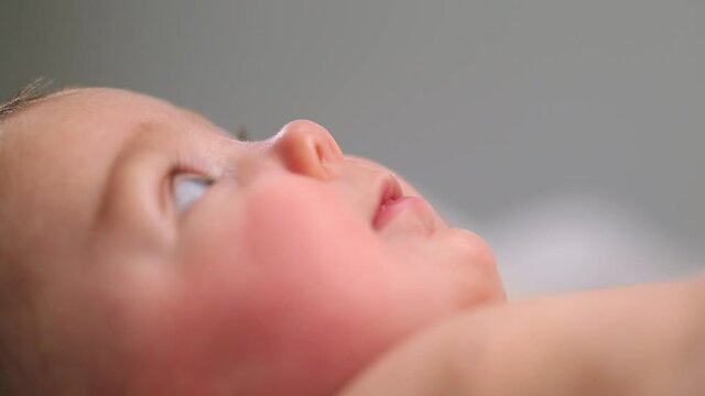 Caucasian baby girl looking up