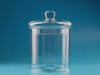 glass jar for bulk products on a blue background