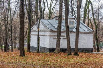 White stone industrial city power supply building in the autumn park