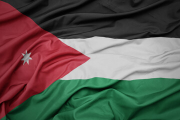 waving colorful national flag of jordan.