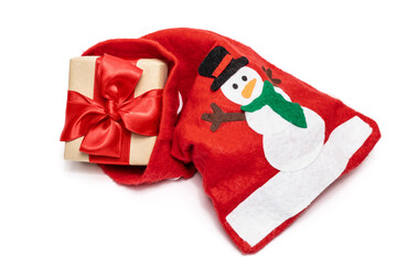 Gift with a red ribbon and a bag with a snowman