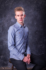 Cute young man dressed in casual studio portrait.