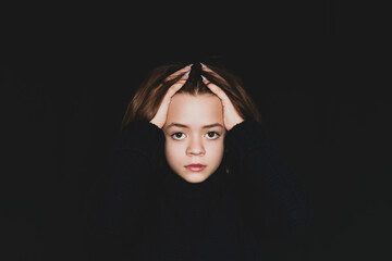 Fototapeta premium Young girl posing in front of the camera