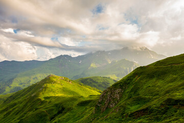 Fototapeta premium Beautiful mountain landscape at Caucasus mountains with clouds and cloudy sky.