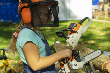kid.  lumberjack's protective helmet. chainsaw