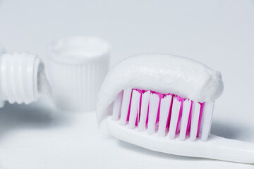 Fototapeta na wymiar toothpaste on the brush close-up
