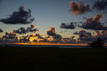 Cumulus clouds over the sea in the sunset