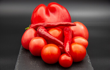 Red vegetables with black background