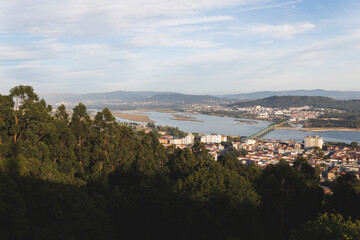Viana do Castelo Portugal view over the city red orange roofs rooftops hill mountain sunset warm light Limia river Ponte Eiffel bridge