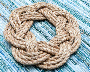 Hemp wreath on green weaved background