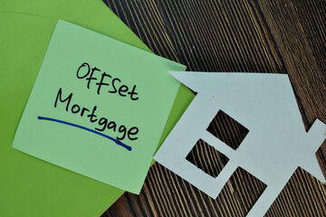 Offset Mortgage write on sticky notes isolated on Wooden Table.
