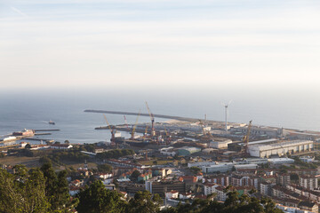 Viana do Castelo Portugal view over the city red orange roofs rooftops hill mountain sunset warm light Limia river