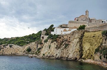 Fototapeta na wymiar Old castle on the cliff in Ibiza, Spain