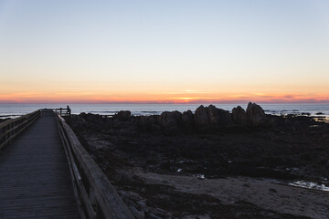 Praia do Coral sunset Viana do Castelo Portugal shore coast beach rocks sand footbridge pathway