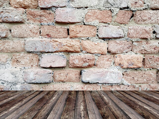 Room interior with grunge brick wall and wood floor background.