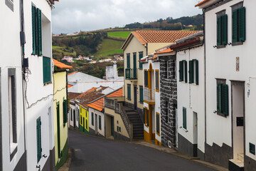 Fototapeta na wymiar Sao Miguel island Portugal small town hill mountain green fields colorful houses 