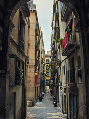 Narrow street in old town of Barcelona, Spain