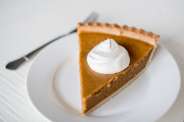 whipped cream dollop on piece of pie