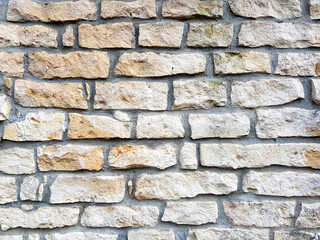 Old bright white pattern stone wall texture.